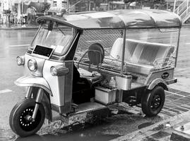 Black and white picture of driving tuk tuk Bangkok Thailand. photo