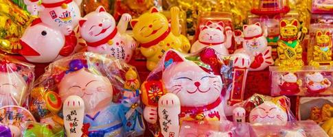 Golden chinese cat Souvenirs in Souvenir shop in Bangkok Thailand. photo