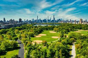 Central Park aerial view in Manhattan, New York. huge beautiful park is surrounded by skyscraper photo
