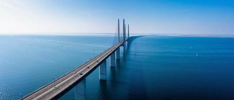 Panoramic aerial view of the Oresundsbron bridge between Denmark and Sweden. Oresund Bridge view at sunset photo