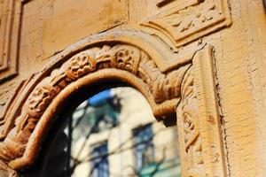 Brown wooden vintage door element with glass window photo