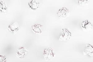 overhead shot of crumpled paper in oder on white background. great idea concept photo