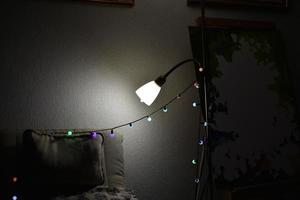 White chandeliers and lamps in a dark room photo