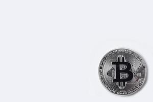 silver bitcoin isolated on white background, cryptocurrency physical bitcoin coin photo