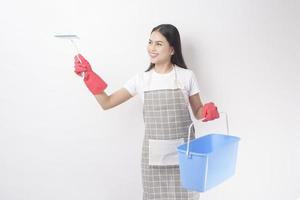 Beautiful woman housekeeper portrait on white background photo