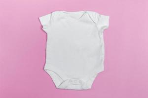 Baby body mockup, white on a colored background. Close up.