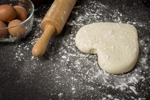 Ingredients bakery making on black wooden table photo