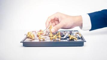 Close up of Business man is playing chess, business management strategy concept photo