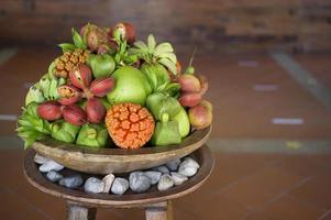 A view of various exotic fruit presented at reception desk of hotel. photo