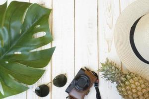 Summer accessories on white wooden  background photo