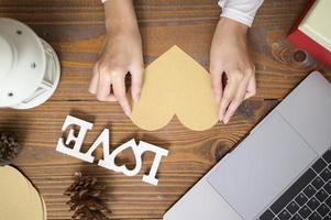 Top view of gift box with Christmas decorations over wooden table, holiday and background concept photo