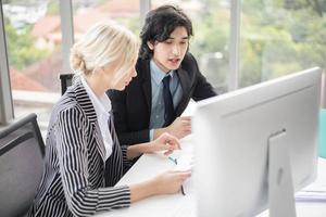 Business people are analyzing financial report photo