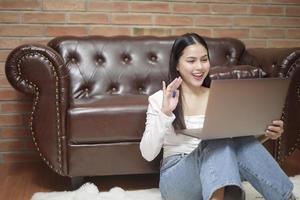 Beautiful woman is working from home photo