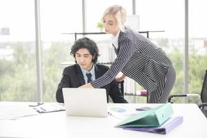 Business people are analyzing financial report photo