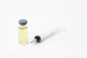 vaccine with syringe on white background photo