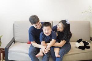 Happy family are enjoying on sofa at home, Safety home activity concept photo