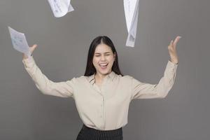 portrait of beautiful  woman is happy with business successful on gray background photo