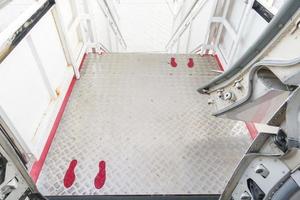 foot sign on airplane corridor, Social distancing protocol on aviation photo