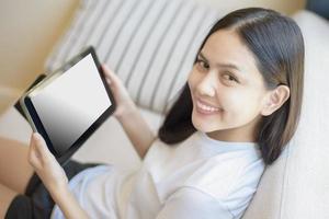 Tablet monitor view mockup over girl shoulders at home