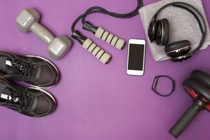 Fitness equipment on purple mat photo