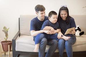 Happy family are enjoying on sofa at home, Safety home activity concept photo