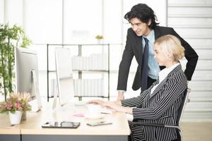 Business people are analyzing financial report photo