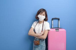 portrait of young traveler woman with face mask , New normal travel concept photo