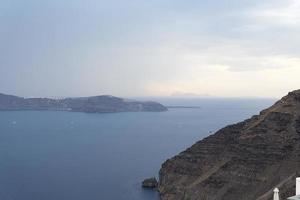 Sweeping landscape overlooking the island of Santorini, Greece photo