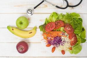 Vegetables Salad on white  wooden  background photo