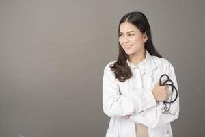 Smart woman doctor is holding stethoscope photo