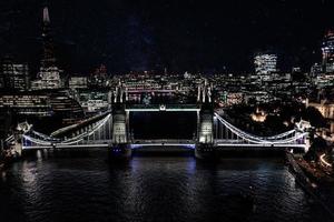 Beautiful view of the Tower bridge over river Thames at night. photo