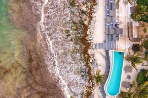 Top view of swimming pool on the cliff edge photo