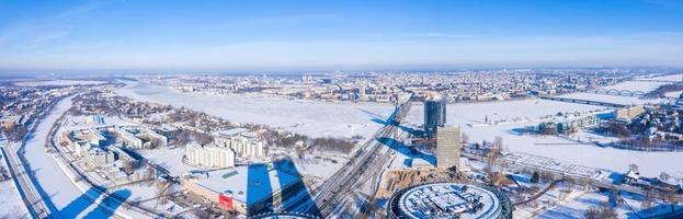 Aerial panoramic view of the Riga city during magical white winter day. Ice old Latvia. photo