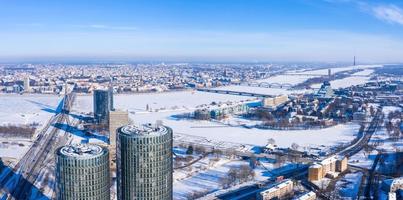 Aerial panoramic view of the Riga city during magical white winter day. Ice old Latvia. photo