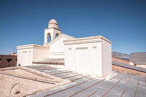 Rooftop of old building with spire on dome structure photo