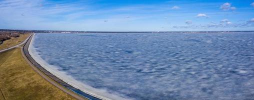 Panoramic aerial view of the winter dam near hydroelectric power plant. photo