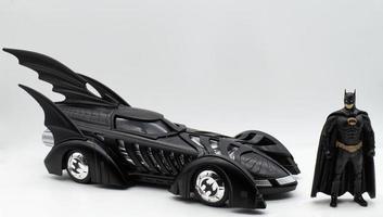 Bologna, Italy, 2022 Black diecast batmobile isolated on white background photo