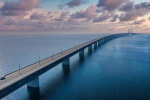 Panoramic aerial view of the Oresundsbron bridge between Denmark and Sweden. Oresund Bridge view at sunset photo