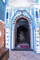 Abstract ornate decor inside traditional arched entrance of building photo