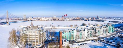 Aerial panoramic view of the Riga city during magical white winter day. Ice old Latvia. photo