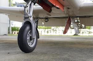 Close up of airplane wheel in an airfield photo