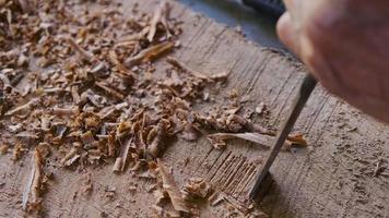 Local man using chisel making traditional handicrafts. video