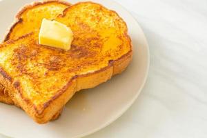 French toasted with butter and honey photo