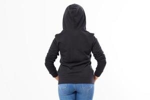 back view - woman in a hoodie on her head isolated on white background photo