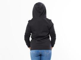 back view - woman in a hoodie on her head isolated on white background photo