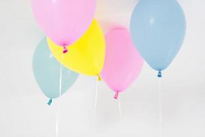 Colorful party balloons background. Isolated on white. Copy space photo