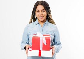 Portrait of a happy smiling afro woman holding present box boxes isolated over white background