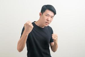 young Asian man with punching hand photo