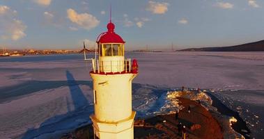 Aerial view of the seascape with a white lighthouse. photo