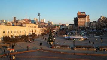 Vladivostok, Russia - January 7, 2022- City landscape with a view of the embankment with a Christmas tree. photo